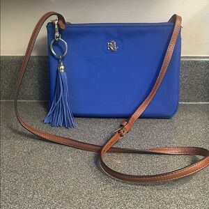 Ralph Lauren crossbody. Polyurethane with leather strap. Gold hardware.